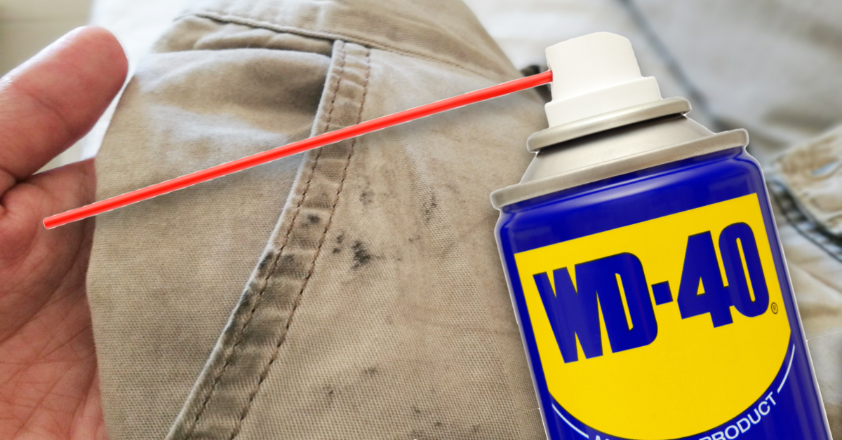 Eine mit Ã–lflecken verschmutzte Hose und davor eine Dose WD-40.